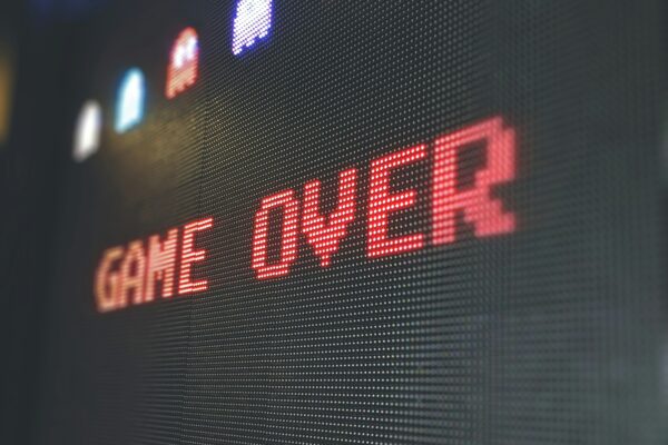 Pixelated video game shows a game over screen display, is it over for the video game industry