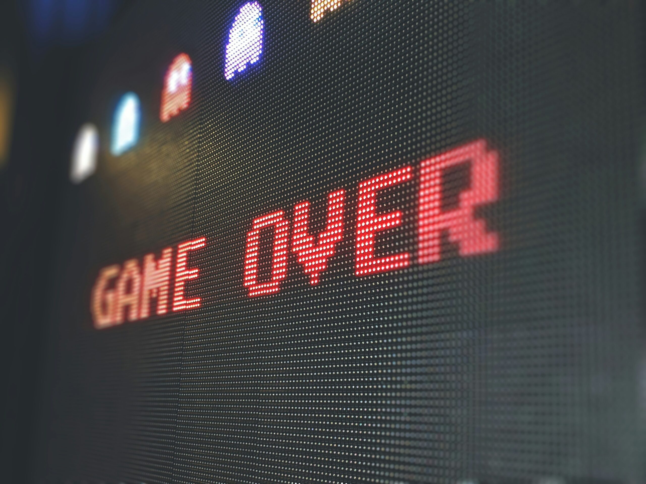 Pixelated video game shows a game over screen display, is it over for the video game industry