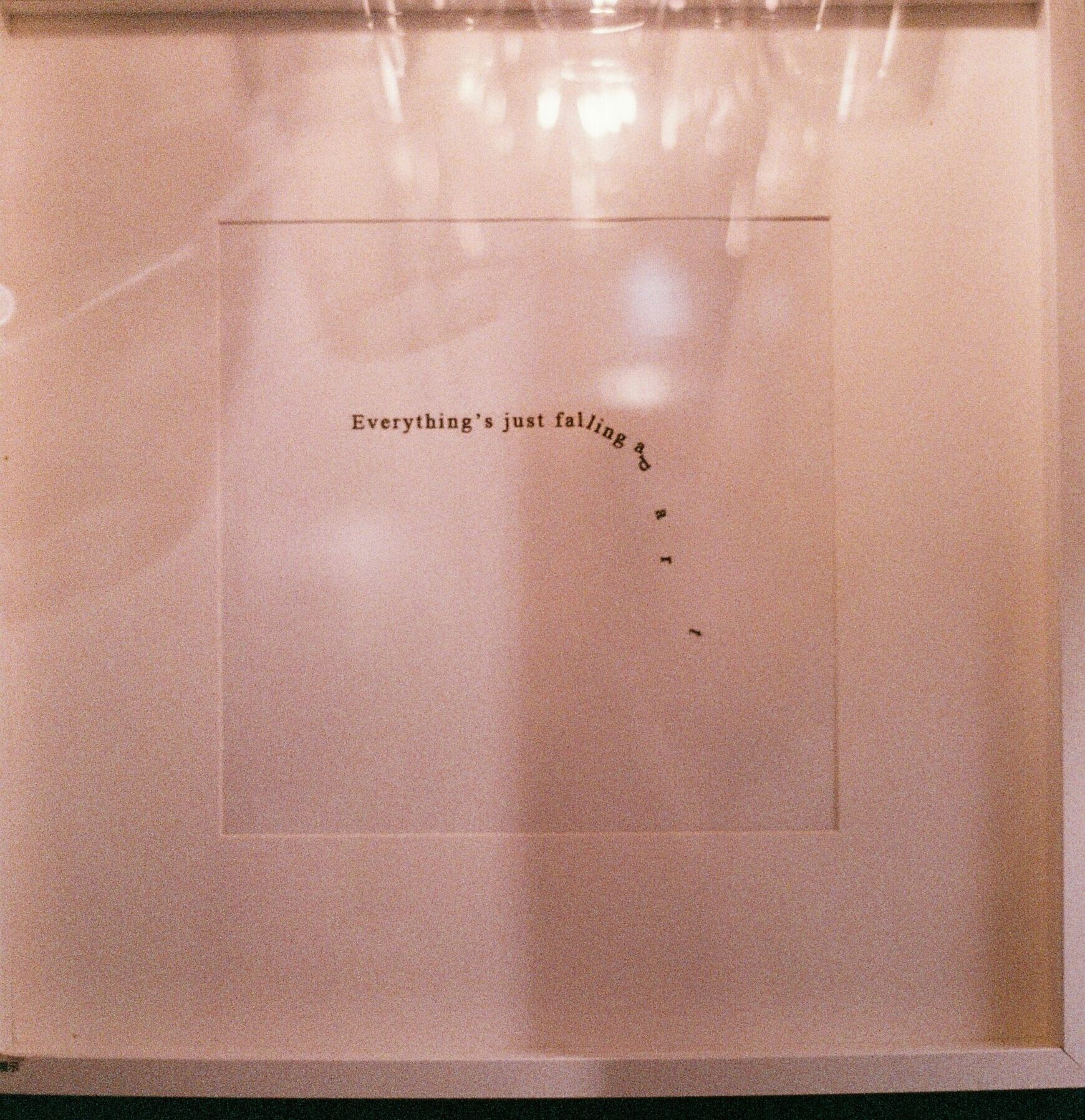 Text artwork with falling letters, symbolic of art and it's meaning