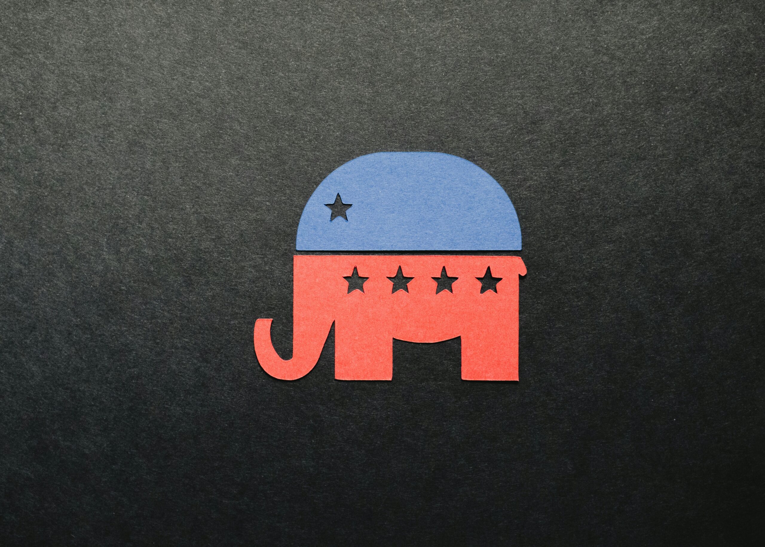 Red elephant with blue hat design, a symbol of the republican party as we talk about what they are doing to education and why