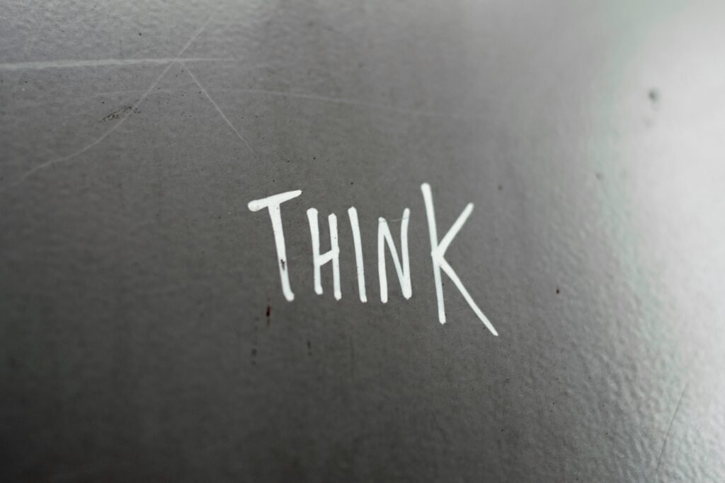 Word 'THINK' written on surface, symbolizing critical thinking.