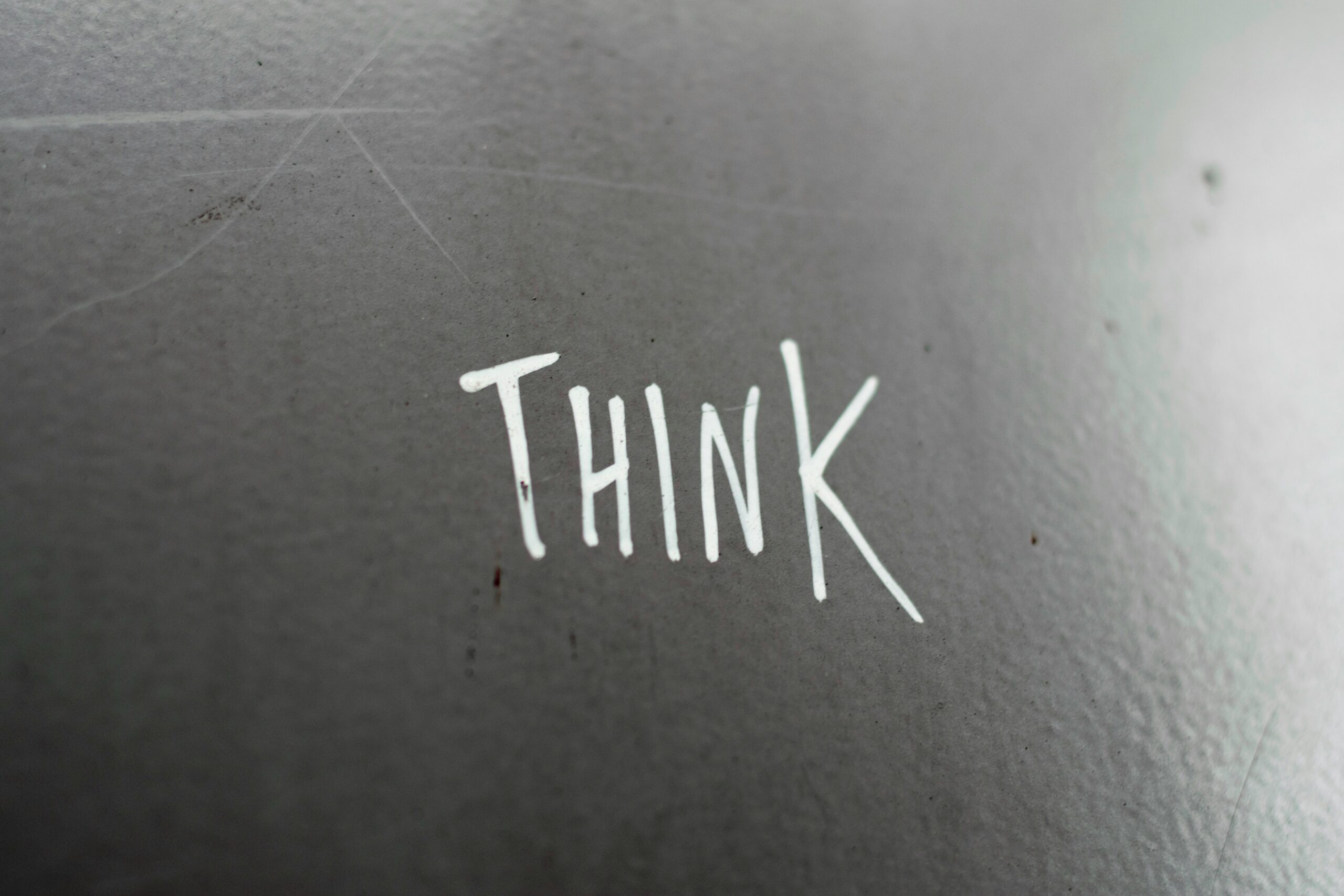 Word 'THINK' written on surface, symbolizing critical thinking.