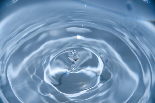 Water Scarcity. The image shows a drop of water bouncing in a pool