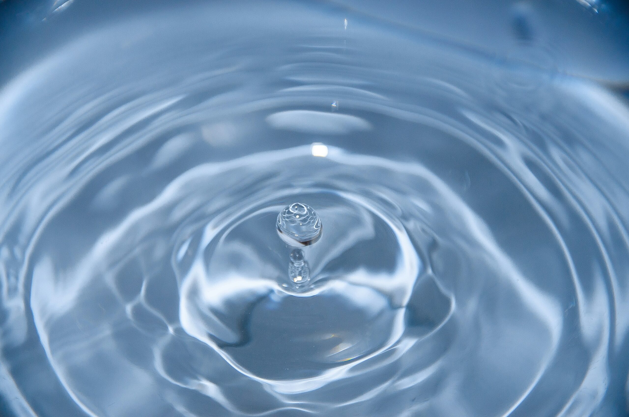 Water Scarcity. The image shows a drop of water bouncing in a pool