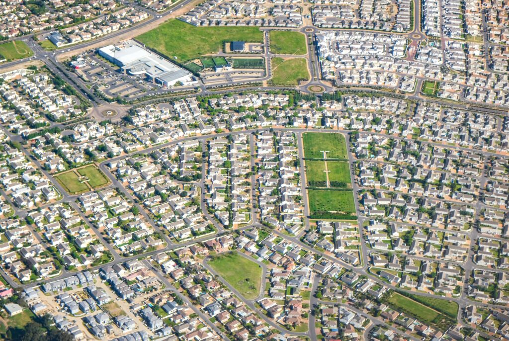 Discover this expansive suburban neighborhood from above, showcasing modern residential planning for housing and more.