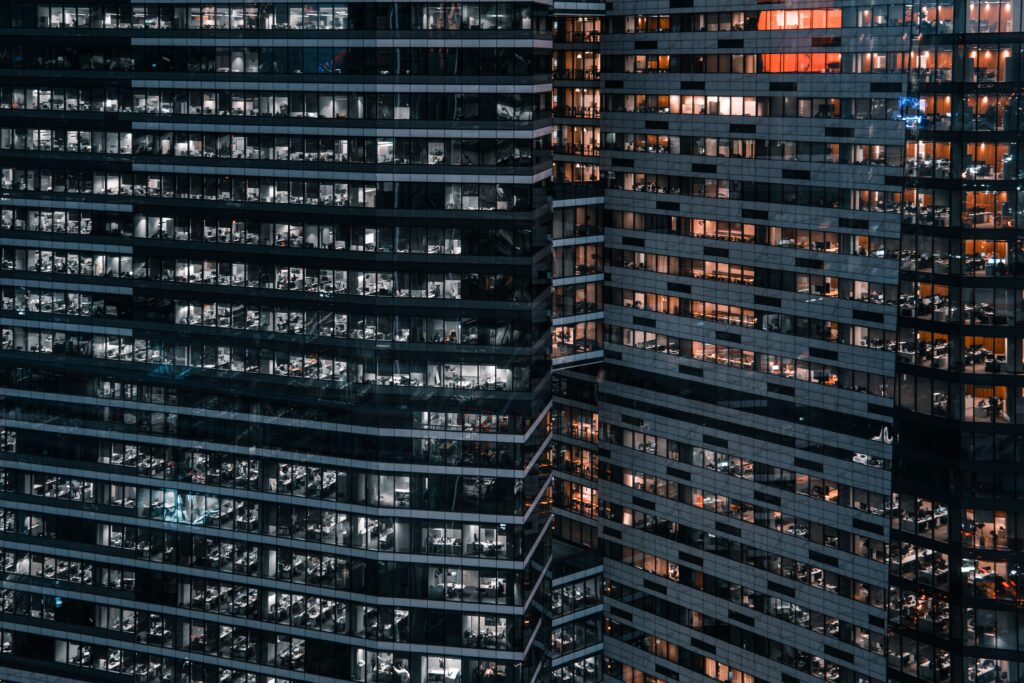 Close-up view of modern office buildings in Moscow, showcasing urban architecture at night.
